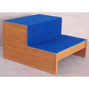Exercise foot stepper with a blue cushioned two-step platform designed for physiotherapy, rehabilitation, balance training, and step practice.