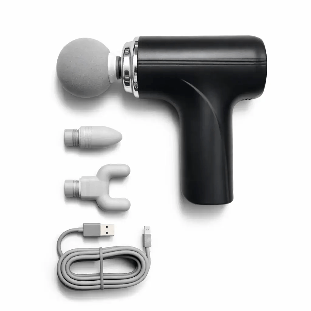 Portable percussion massage gun with interchangeable massage attachments and USB charging cable for targeted muscle massage and recovery.