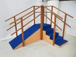 Exercise Corner Stair Case Therapy Wooden physiotherapy rehabilitation staircase with blue padded steps, inclined ramps, and multiple parallel handrails for gait training, balance exercises, and lower-limb rehabilitation.