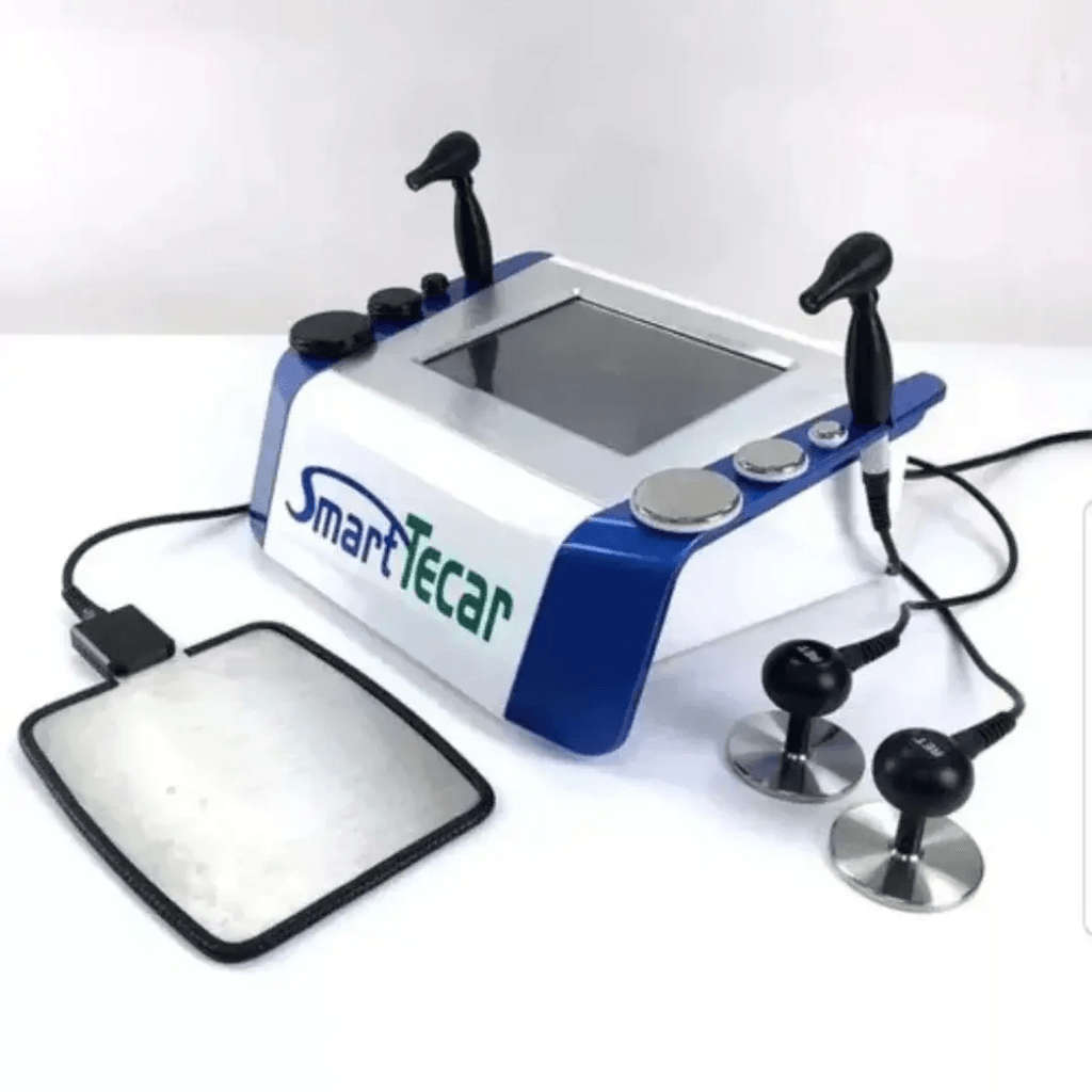 The SmartTecar TECAR Therapy Machine is an advanced radiofrequency-based physiotherapy system designed for professional rehabilitation, sports recovery, musculoskeletal therapy, and clinical pain-management applications. It uses Capacitive Energy Transfer (CET) and Resistive Energy Transfer (RET) technology to deliver controlled radiofrequency energy through specialized applicators.

SmartTecar is designed to provide a structured approach to superficial and deeper tissue-focused therapy. Depending on the selected mode, applicator, treatment area, and clinical protocol, the system can be incorporated into physiotherapy programs for muscles, joints, tendons, soft tissues, and other musculoskeletal applications.

The system is suitable for physiotherapy clinics, rehabilitation centres, sports recovery facilities, orthopedic practices, and professional wellness environments. PHYSIOMODALITIES™ provides TECAR therapy equipment for clinics looking to add radiofrequency-based rehabilitation technology to their treatment setup.

What Is the SmartTecar TECAR Therapy Machine?

The SmartTecar TECAR Therapy Machine is a professional radiofrequency diathermy system that uses two primary energy-transfer approaches: CET and RET.

CET, or Capacitive Energy Transfer, is generally used for more superficial soft-tissue applications. RET, or Resistive Energy Transfer, is designed for treatment approaches involving tissues with greater resistance, such as deeper musculoskeletal structures.

The SmartTecar system is designed around controlled RF energy delivery through an active applicator and a return electrode. The resulting endogenous thermal effect can be incorporated into physiotherapy protocols where controlled tissue heating is clinically appropriate.

SmartTecar models available from manufacturers commonly operate across approximately 300–450 kHz, with some versions specified around 300 kHz RET and 450 kHz CET. Exact frequency and configuration should always be confirmed for the supplied machine.

How Does SmartTecar TECAR Therapy Work?

TECAR therapy uses radiofrequency energy to create an internal thermal response within the treated area.

The basic treatment process involves:

Selecting the appropriate treatment mode.
Choosing the suitable CET or RET applicator.
Preparing the treatment area according to clinical protocol.
Applying the required conductive medium where specified.
Positioning the return electrode correctly.
Adjusting the treatment intensity and parameters.
Moving the applicator over the selected treatment area.
Monitoring patient comfort and tissue response throughout treatment.

The therapist controls the treatment according to the patient's assessment, treatment objective, selected applicator, and machine instructions.

Key Features of SmartTecar
CET & RET Dual Technology

SmartTecar combines Capacitive Energy Transfer and Resistive Energy Transfer in one system. This allows the operator to select the energy-transfer method according to the treatment area and clinical objective.

Radiofrequency Diathermy

The machine uses radiofrequency energy to produce a controlled thermal response within tissues. TECAR-based treatment is generally incorporated into rehabilitation programs where tissue warming and controlled energy transfer are appropriate.

Dual-Frequency Operation

Published SmartTecar specifications commonly identify approximately 300 kHz RET and 450 kHz CET operation. Some versions may use a broader 300–450 kHz range, so the exact specification should be checked against the supplied model.

Touchscreen Control

SmartTecar systems are available with a large touchscreen interface. Published SmartTecar specifications identify a 10.4-inch LCD touchscreen, providing a convenient interface for treatment control and parameter adjustment.

Multiple Applicator Sizes

Standard SmartTecar configurations can include 20 mm, 40 mm, and 60 mm applicator tips, allowing the therapist to select an appropriate working surface for different anatomical areas.

Adjustable Treatment Parameters

The operator can adjust available treatment parameters according to the selected mode and clinical protocol. This provides flexibility for different treatment areas and patient requirements.

Professional Clinical Design

The system is designed for professional physiotherapy and rehabilitation environments where controlled RF therapy can be incorporated alongside other treatment modalities.

Applications of SmartTecar

The SmartTecar TECAR Therapy Machine may be incorporated into professional rehabilitation programs for a range of musculoskeletal applications.

Common clinical applications can include:

Sports injury rehabilitation
Muscle recovery programs
Joint rehabilitation
Back and lumbar rehabilitation
Neck and cervical rehabilitation
Shoulder rehabilitation
Knee rehabilitation
Tendon and soft-tissue rehabilitation
Muscle relaxation programs
Mobility-focused rehabilitation
Post-exercise recovery
Selected post-operative rehabilitation programs

The suitability of TECAR therapy depends on the patient's condition, clinical assessment, treatment goals, and applicable contraindications.

Potential Benefits of TECAR Therapy
Controlled Tissue Heating

Radiofrequency energy can create a controlled thermal response in tissues. This warming effect may be incorporated into rehabilitation programs where increased local tissue temperature is desired.

Support for Circulation

Thermal effects associated with TECAR therapy may support local circulation when appropriately applied as part of a professional treatment protocol.

Muscle Relaxation

TECAR treatment may be incorporated into programs intended to address muscle tightness and support relaxation before or alongside therapeutic exercise and manual techniques.

Rehabilitation Support

The technology can complement other physiotherapy approaches, including exercise therapy, manual therapy, mobility work, and other electrotherapy modalities.

Sports Recovery

Professional sports-rehabilitation facilities may use TECAR technology as part of structured recovery programs following physical activity or selected sports injuries.

Non-Invasive Treatment

TECAR therapy is a non-invasive treatment modality that does not require surgical intervention or skin incisions.

CET vs RET in SmartTecar
Feature	CET	RET
Full Form	Capacitive Energy Transfer	Resistive Energy Transfer
Typical Approach	More superficial tissue-focused applications	Deeper/resistive tissue-focused applications
Common Applicator	Capacitive electrode	Resistive electrode
Typical Uses	Soft tissue and muscle-focused protocols	Joint, tendon and deeper musculoskeletal protocols
Energy Transfer	Capacitive	Resistive
Clinical Use	Selected physiotherapy programs	Selected rehabilitation programs

The exact tissue response depends on the machine, frequency, applicator, intensity, treatment technique, and patient characteristics. These modes should be selected by a trained professional.

How to Use SmartTecar TECAR Therapy Machine
Step 1: Patient Assessment

Assess the patient's condition, treatment history, contraindications, and rehabilitation goals before beginning therapy.

Step 2: Select Treatment Mode

Choose CET or RET according to the treatment objective and professional protocol.

Step 3: Select the Applicator

Choose the appropriate applicator size for the anatomical area being treated.

Step 4: Prepare the Treatment Area

Prepare the skin and apply the appropriate conductive medium if required by the machine and manufacturer instructions.

Step 5: Position the Return Electrode

Place the return electrode correctly according to the manufacturer's instructions.

Step 6: Set Treatment Parameters

Adjust the available intensity, mode, and other treatment settings according to the patient's requirements.

Step 7: Begin Treatment

Start the therapy gradually and maintain appropriate applicator movement over the treatment area.

Step 8: Monitor the Patient

Monitor patient comfort and tissue response continuously. Treatment parameters should be adjusted when clinically appropriate.

Step 9: Complete the Session

Reduce the intensity before finishing, stop the output, remove the applicator and return electrode safely, and inspect the patient's response.

Safety Precautions

The SmartTecar TECAR Therapy Machine should be operated by appropriately trained professionals.

Important precautions include:

Complete an appropriate patient assessment before treatment.
Follow the manufacturer's operating instructions.
Check all cables, applicators, and electrodes before use.
Use the correct conductive medium where required.
Ensure proper placement of the return electrode.
Begin with clinically appropriate intensity.
Monitor patient comfort throughout the session.
Avoid excessive heating of the treatment area.
Do not use damaged applicators or cables.
Keep the equipment away from liquids.
Follow electrical safety requirements.
Stop treatment if the patient experiences unexpected or significant discomfort.
Follow manufacturer-recommended cleaning, servicing, and maintenance procedures.

Patients with implanted electronic devices, certain medical conditions, impaired sensation, pregnancy-related considerations, acute medical problems, or other potential contraindications should be evaluated by an appropriately qualified healthcare professional before TECAR therapy.

Technical Specifications
Specification	SmartTecar
Product Type	TECAR Therapy Machine
Technology	Capacitive & Resistive Energy Transfer
RF Frequency	Approx. 300–450 kHz*
RET Frequency	Approx. 300 kHz*
CET Frequency	Approx. 450 kHz*
Maximum Power	Up to 300 W*
Display	10.4-inch LCD Touchscreen*
Standard Applicator Sizes	20 / 40 / 60 mm*
Treatment	RF Diathermy / TECAR Therapy
Application	Physiotherapy & Rehabilitation
Power Supply	110V / 220V configuration-dependent*

*Specifications can vary between SmartTecar manufacturers and configurations. Published SmartTecar references identify 300 kHz RET, 450 kHz CET, up to 300 W, 10.4-inch touchscreen operation, and 20/40/60 mm standard tips. Confirm the final technical specifications against the supplied PHYSIOMODALITIES™ model and manufacturer datasheet before publishing.

Who Can Use SmartTecar?

SmartTecar is intended for professional clinical environments and should be operated by appropriately trained practitioners.

Suitable professional users may include:

Physiotherapists
Rehabilitation professionals
Sports-rehabilitation practitioners
Orthopedic rehabilitation teams
Qualified healthcare professionals trained in TECAR therapy

The machine should be used as part of an appropriate treatment plan rather than as a replacement for patient assessment.

Why Clinics Use SmartTecar

A TECAR system can add a radiofrequency-based modality to a clinic's existing physiotherapy equipment.

SmartTecar provides:

CET and RET treatment options
Adjustable RF energy delivery
Touchscreen operation
Multiple applicator sizes
Superficial and deeper tissue-focused treatment approaches
Professional rehabilitation applications
Non-invasive treatment
Compatibility with broader physiotherapy programs

It can be used alongside exercise therapy, manual therapy, electrotherapy, rehabilitation exercises, and other professionally selected treatment techniques.

Why Choose PHYSIOMODALITIES™?

PHYSIOMODALITIES™ provides physiotherapy and rehabilitation equipment for professional clinical environments. Its TECAR range includes Smart TECAR systems alongside other rehabilitation technologies.

PHYSIOMODALITIES ENTERPRISES supports clinics with physiotherapy equipment, installation assistance, training support, delivery, and after-sales service. The company's TECAR product range includes Smart TECAR, TECAR 448K, and other therapy configurations.

For clinics planning to expand their rehabilitation equipment setup, SmartTecar can provide an additional RF-based treatment modality for appropriately selected patients.

Conclusion

The SmartTecar TECAR Therapy Machine is a professional radiofrequency therapy system designed around Capacitive Energy Transfer (CET) and Resistive Energy Transfer (RET). Its combination of dual treatment modes, touchscreen operation, adjustable energy delivery, and multiple applicator options makes it suitable for professional physiotherapy and rehabilitation environments.

TECAR therapy can be incorporated into treatment programs involving muscle recovery, sports rehabilitation, joint-focused therapy, soft-tissue management, and other selected musculoskeletal applications. The exact treatment approach should always be determined by a qualified professional after patient assessment.

For final product specifications, the supplied SmartTecar model should be checked carefully because frequency, power, accessories, display, applicator configuration, and electrical specifications can differ between versions.

Frequently Asked Questions
1. What is the SmartTecar TECAR Therapy Machine?

SmartTecar is a radiofrequency-based TECAR therapy system that uses CET and RET energy-transfer technologies for professional physiotherapy and rehabilitation applications.

2. What is the difference between CET and RET?

CET generally focuses on more superficial tissue applications, while RET is commonly used for deeper or more resistive tissue-focused treatment approaches.

3. What frequency does SmartTecar use?

Published SmartTecar specifications commonly identify approximately 300 kHz RET and 450 kHz CET, with some versions described across a 300–450 kHz range.

4. Is SmartTecar suitable for sports rehabilitation?

Yes, TECAR systems can be incorporated into professionally supervised sports rehabilitation and recovery programs where clinically appropriate.

5. Who should operate a SmartTecar machine?

The machine should be operated by an appropriately trained physiotherapist, rehabilitation professional, or qualified healthcare practitioner familiar with TECAR therapy.