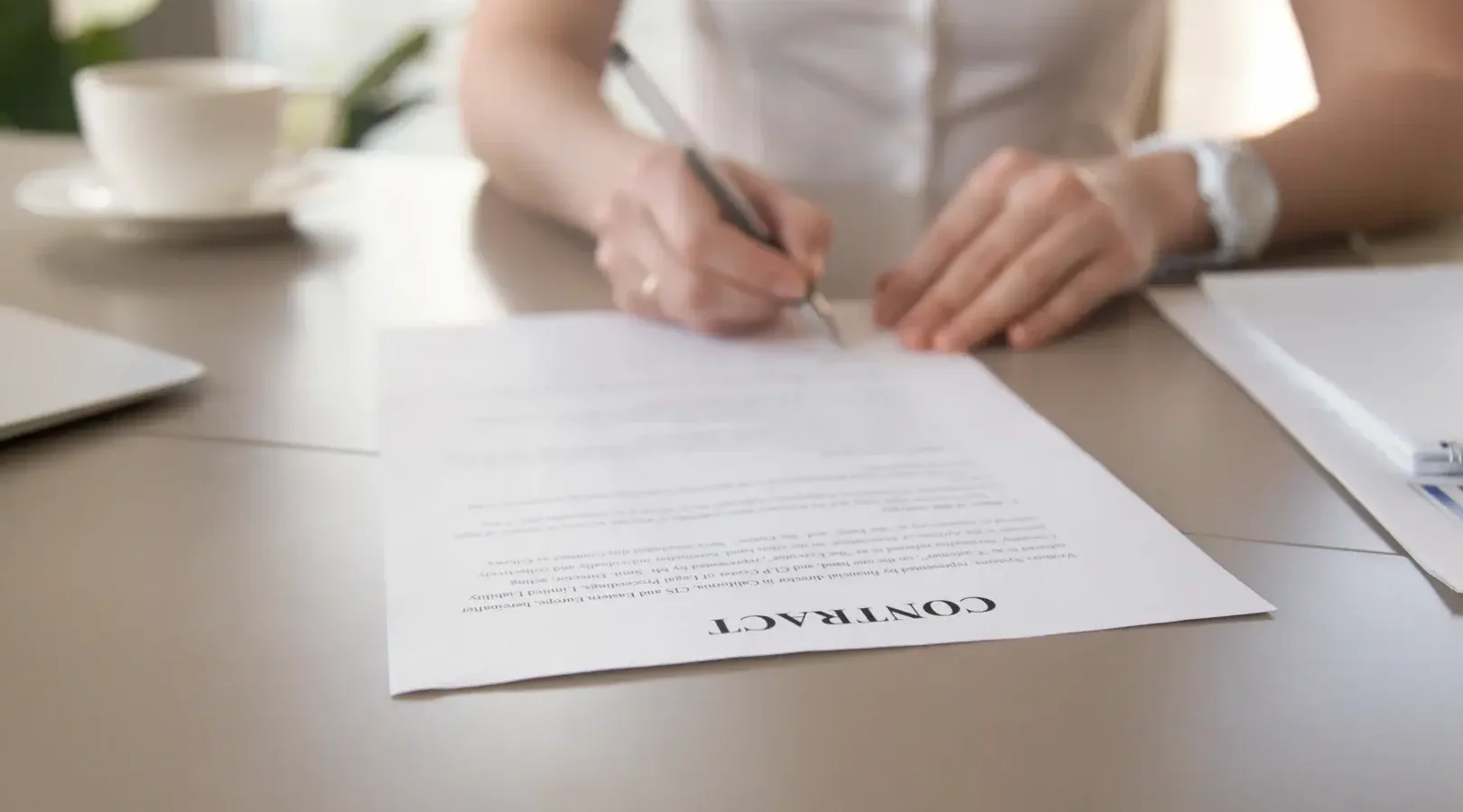 businesswoman-signing-document-female-hands-putting-signature-focus-contract